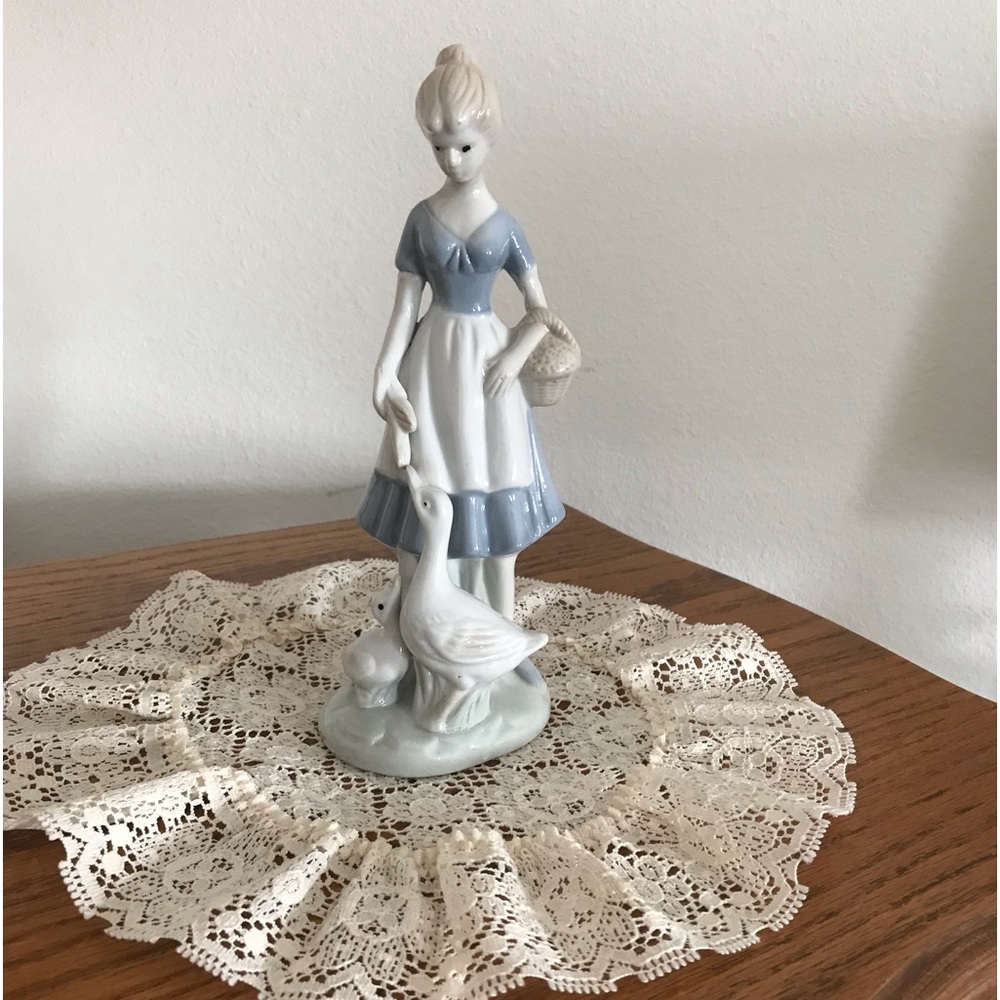 Porcelain Girl Feeding Geese Figurine